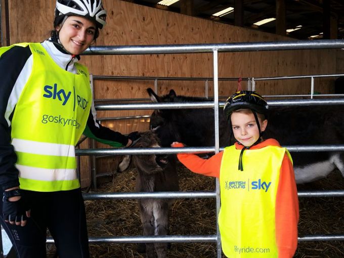 Two of the members of our group having a chat with the donkeys...