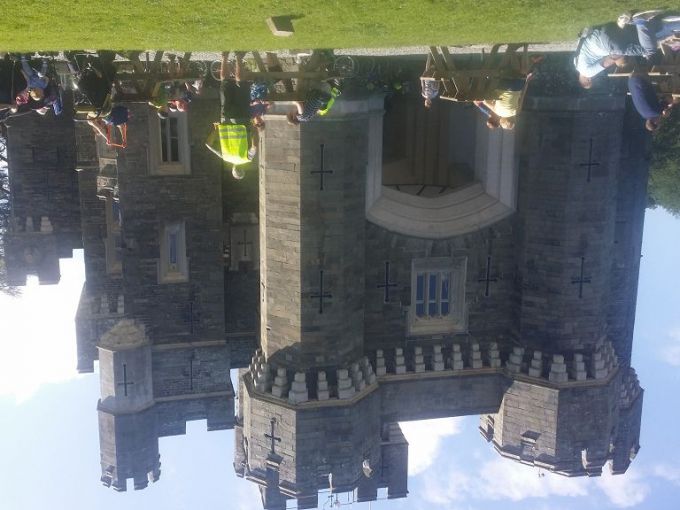 Wide view of Wray Castle  with Sky riders  participants in the foreground.